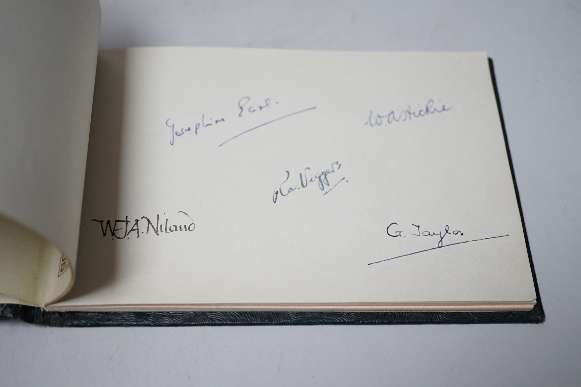 An Autograph book presented to EB Thomas esquire MBE, 4 January 1960 on the occasion of his retirement from public service with the Ministry of housing and local government, signed by his colleagues